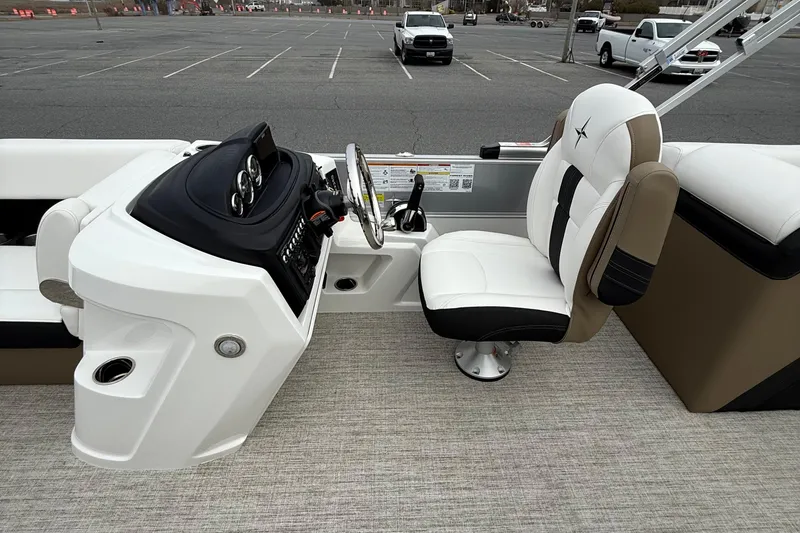 Slide: The Image of 2026 Berkshire 24 RFX CTS boat interior with steering console and captain's chair. - 12