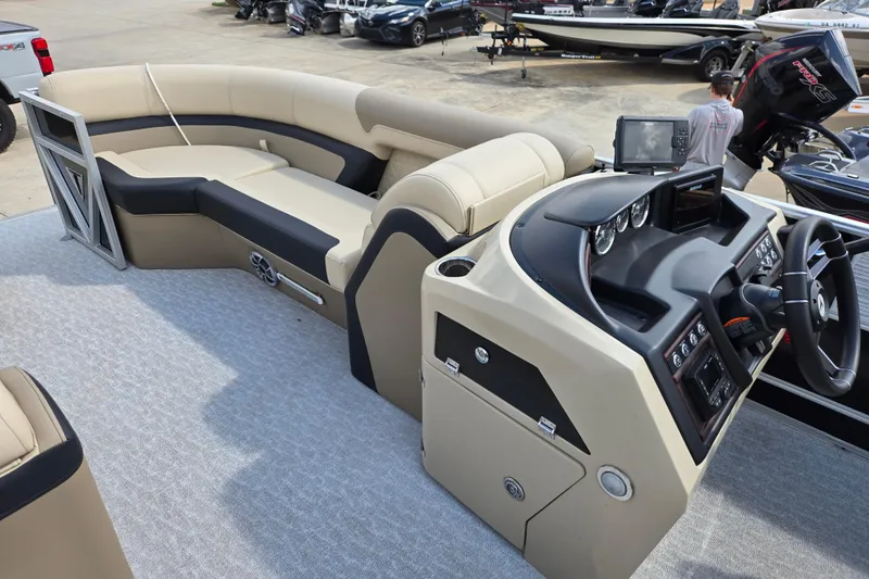 Slide: The Image of 2021 Trifecta SS 23C 2.75 pontoon boat interior with helm and seating area. - 10