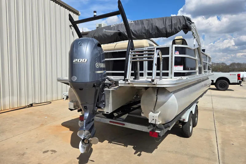 Slide: The Image of 2021 Trifecta SS 23C 2.75 pontoon boat with Yamaha 200 engine on trailer. - 5