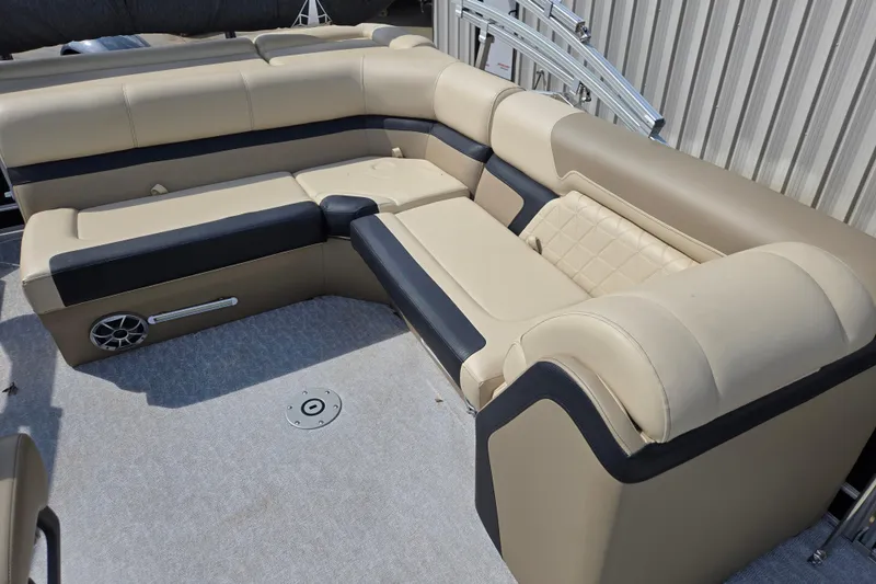 Slide: The Image of Luxurious seating on 2021 Trifecta SS 23C 2.75 pontoon boat, featuring beige and black upholstery. - 6