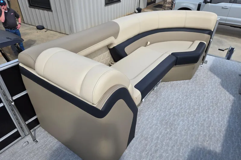 Slide: The Image of Luxurious seating on 2021 Trifecta SS 23C 2.75 pontoon boat, featuring beige and black upholstery. - 7