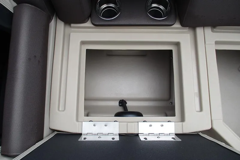 Slide: The Image of 2026 Bentley Pontoons Legacy 200 Navigator storage compartment with cup holders and cushioned seating. - 13