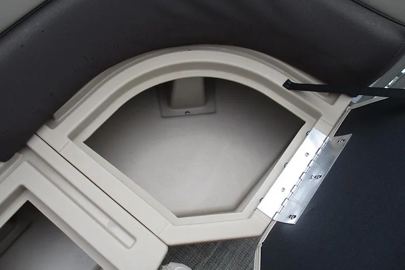 Slide: The Image of 2026 Bentley Pontoons Legacy 200 Navigator storage compartment with open hatch and hinge detail. - 14