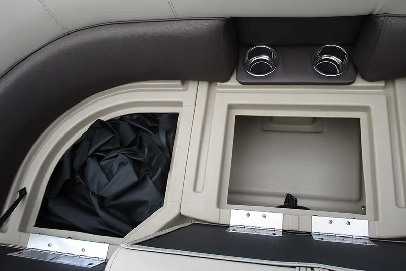 Slide: The Image of 2026 Bentley Pontoons Legacy 200 Navigator storage compartments and cup holders. - 18