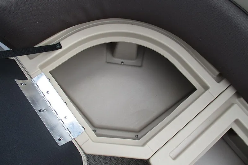 Slide: The Image of 2026 Bentley Pontoons Legacy 200 Navigator storage compartment with beige interior and metal hinge. - 24