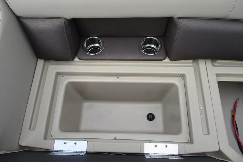 Slide: The Image of 2026 Bentley Pontoons Legacy 200 Navigator interior with cup holders and storage compartment. - 28
