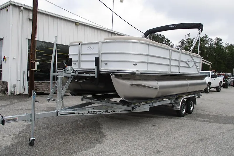 Slide: The Image of 2026 Bentley Pontoons Legacy 200 Navigator on trailer outside dealership. - 3
