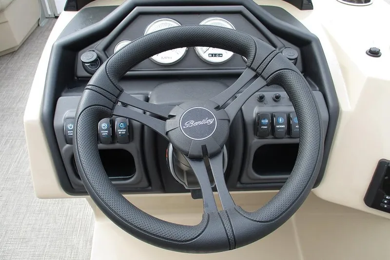 Slide: The Image of 2026 Bentley Pontoons Legacy 200 Navigator steering wheel and dashboard controls. - 31