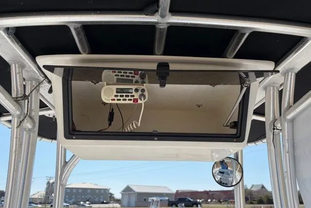 Slide: The Image of 2015 Sportsman Heritage 211 Center Console with mounted radio equipment under T-top. - 12