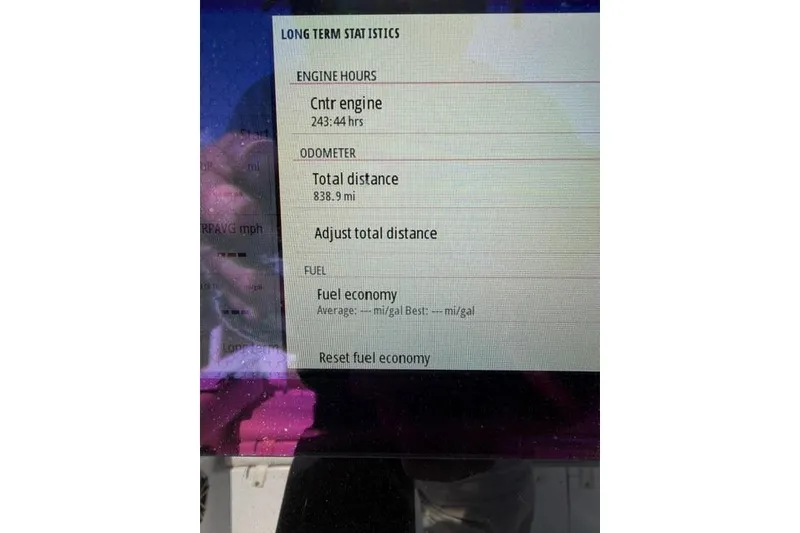 Slide: The Image of Display screen showing engine hours and odometer for 2015 Sportsman Heritage 211 Center Console. - 16