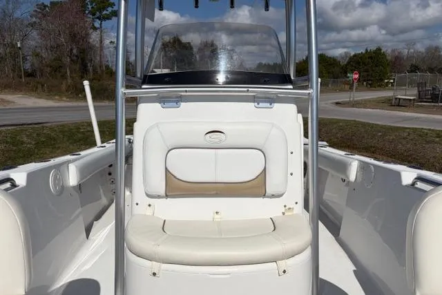 Slide: The Image of 2015 Sportsman Heritage 211 Center Console boat interior with seating and console view. - 8