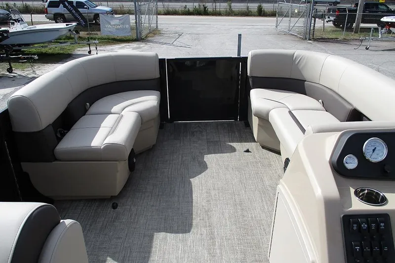 Slide: The Image of Interior of 2026 Bentley Pontoons LE 180 CR with plush seating and control panel. - 10