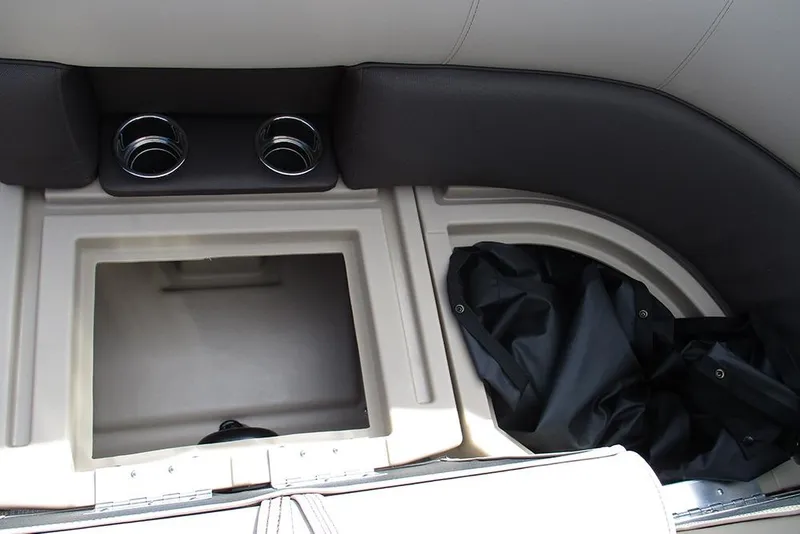 Slide: The Image of Interior storage compartment of 2026 Bentley Pontoons LE 180 CR with cup holders. - 15