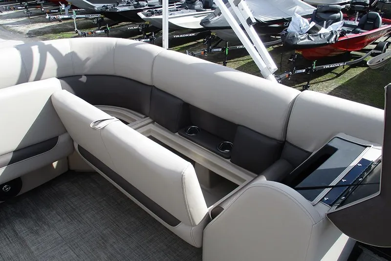 Slide: The Image of 2026 Bentley Pontoons LE 180 CR interior with plush seating and cup holders. - 17