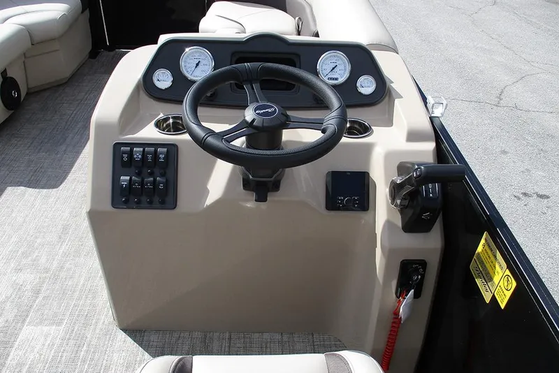 Slide: The Image of 2026 Bentley Pontoons LE 180 CR dashboard with steering wheel and control panel. - 23