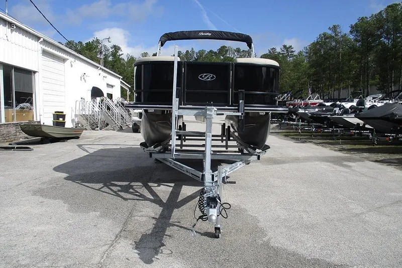 Slide: The Image of 2026 Bentley Pontoons LE 180 CR on trailer, parked outdoors at dealership. - 4