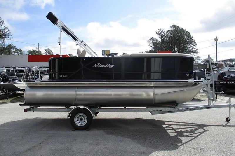 Slide: The Image of 2026 Bentley Pontoons LE 180 CR on trailer, sleek design, outdoor display. - 6