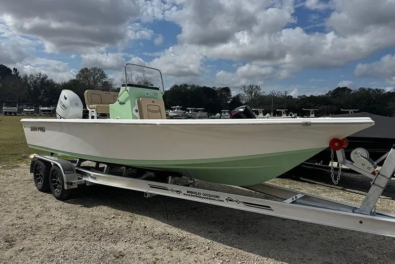 The Image of 2026 Sea Pro 230 Bay boat on trailer under cloudy sky. - 1