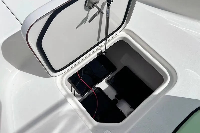 Slide: The Image of Battery compartment of 2026 Sea Pro 230 Bay boat, featuring secure storage and wiring. - 12