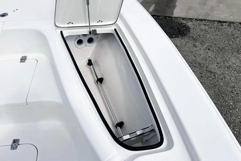 Slide: The Image of Open storage compartment on 2026 Sea Pro 230 Bay boat, showcasing interior design. - 15