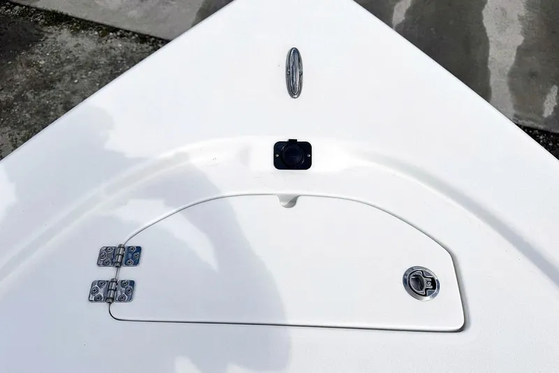 Slide: The Image of Bow storage compartment on 2026 Sea Pro 230 Bay boat, featuring sleek design and durable hinges. - 18