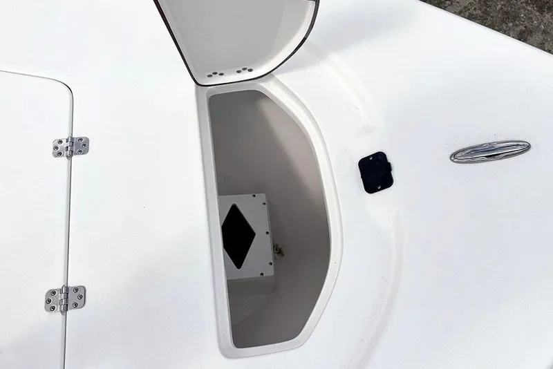 Slide: The Image of Open storage compartment on 2026 Sea Pro 230 Bay boat deck. - 19