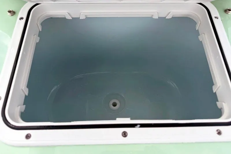 Slide: The Image of 2026 Sea Pro 230 Bay boat storage compartment, open and empty. - 22