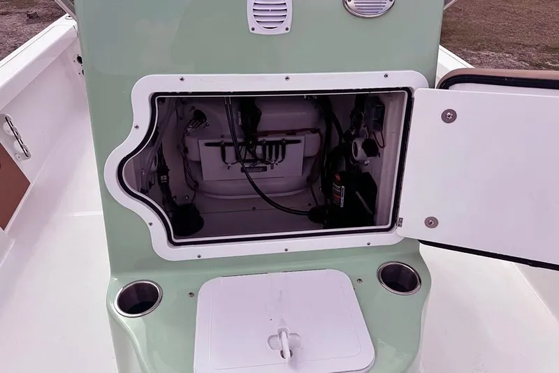 Slide: The Image of Open storage compartment on 2026 Sea Pro 230 Bay boat, showcasing internal components. - 23