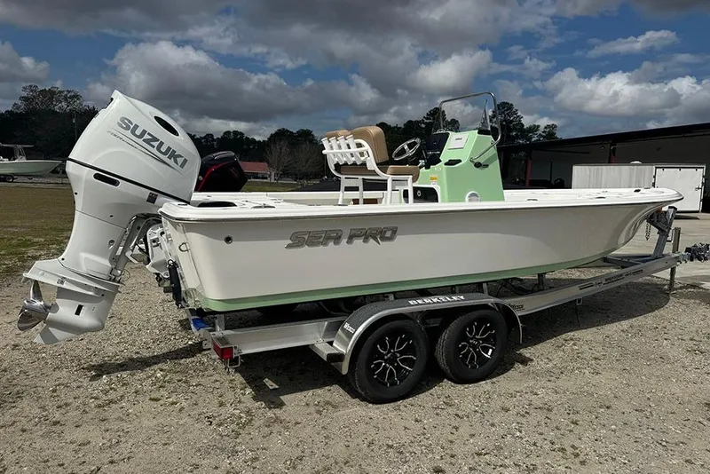 Slide: The Image of 2026 Sea Pro 230 Bay boat on trailer with Suzuki outboard motor. - 3