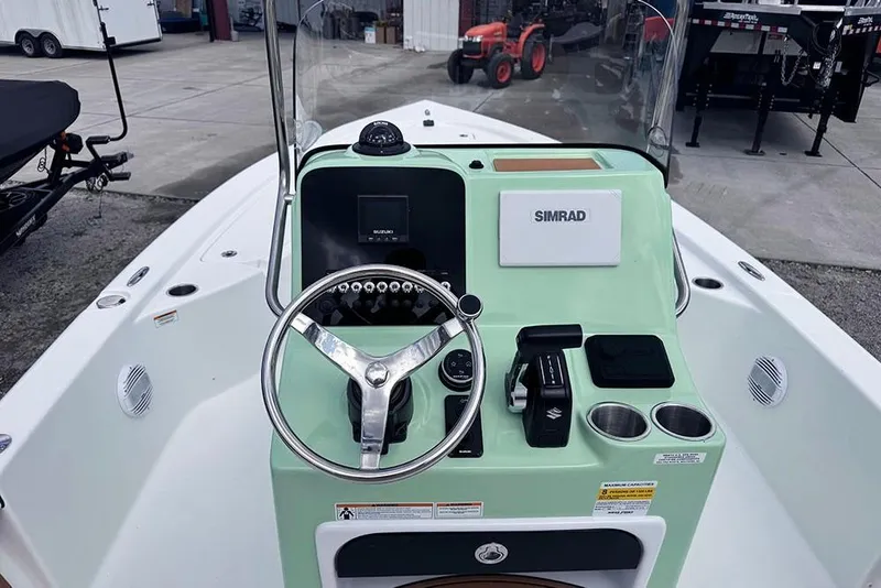 Slide: The Image of 2026 Sea Pro 230 Bay boat dashboard with steering wheel and controls. - 31
