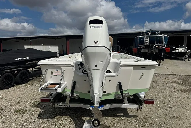 Slide: The Image of 2026 Sea Pro 230 Bay boat with powerful outboard motor on trailer. - 4