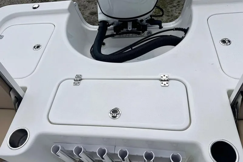 Slide: The Image of 2026 Sea Pro 230 Bay boat deck with storage compartments and rod holders. - 43