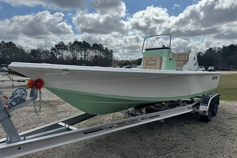Slide: The Image of 2026 Sea Pro 230 Bay boat on trailer under cloudy sky. - 7