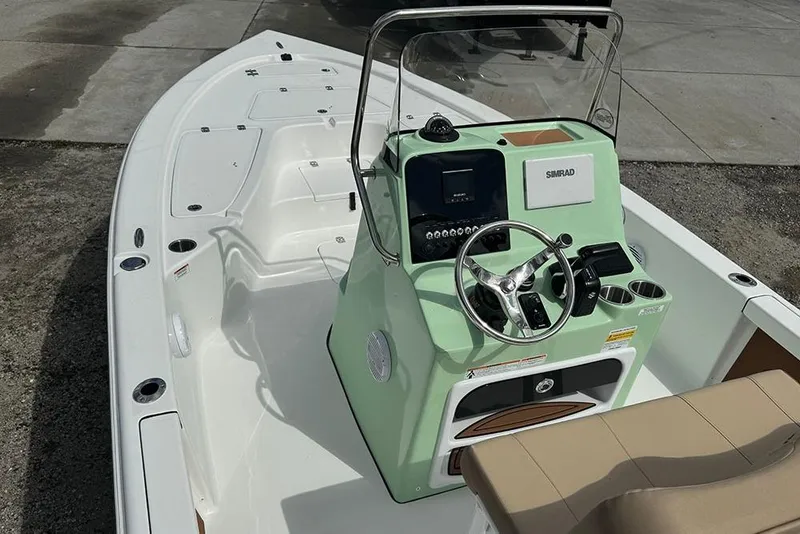 Slide: The Image of 2026 Sea Pro 230 Bay boat with modern console and steering wheel. - 9