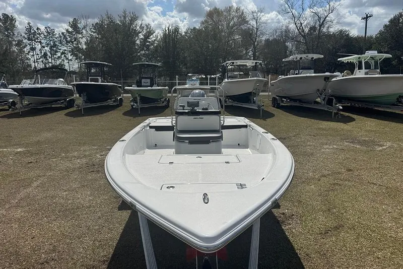 Slide: The Image of 2026 Sea Pro 172 Bay boat displayed outdoors among other boats. - 10