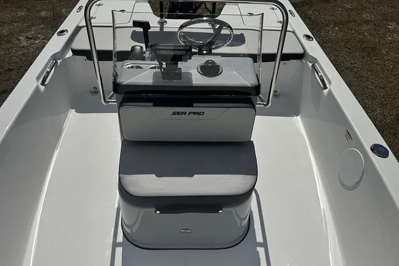 Slide: The Image of 2026 Sea Pro 172 Bay boat interior with steering console and seating. - 17