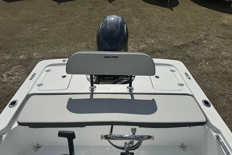 Slide: The Image of 2026 Sea Pro 172 Bay boat, rear view with seating and motor, on land. - 19