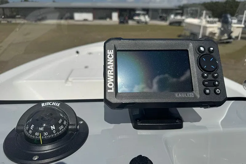 Slide: The Image of Lowrance Eagle 5 GPS and Ritchie compass on 2026 Sea Pro 172 Bay boat dashboard. - 24