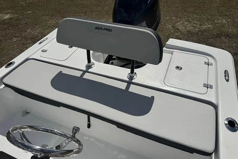 Slide: The Image of 2026 Sea Pro 172 Bay boat interior with steering wheel and seating. - 25