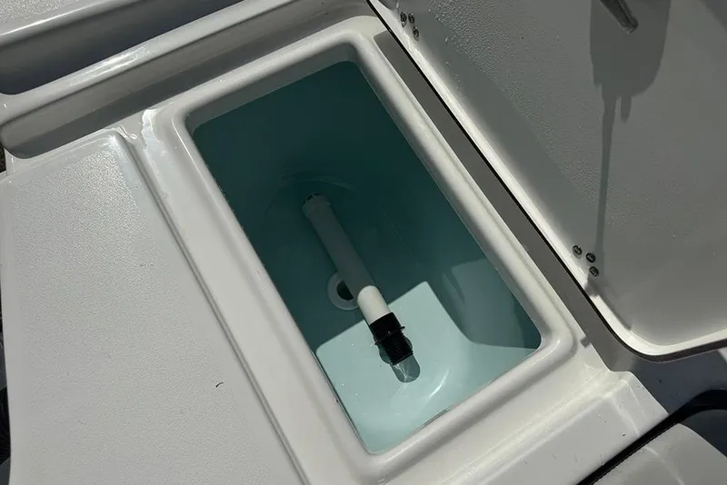 Slide: The Image of 2026 Sea Pro 172 Bay boat livewell with open lid, showcasing interior design. - 28