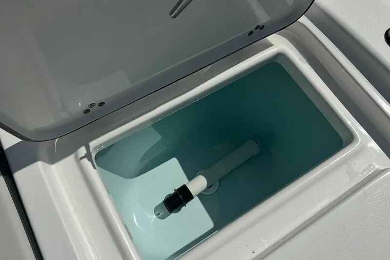 Slide: The Image of Open livewell compartment on 2026 Sea Pro 172 Bay boat, showcasing interior design. - 29