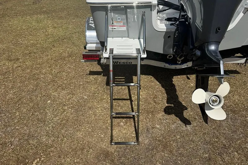 Slide: The Image of 2026 Sea Pro 172 Bay boat with ladder and outboard motor on dry land. - 5