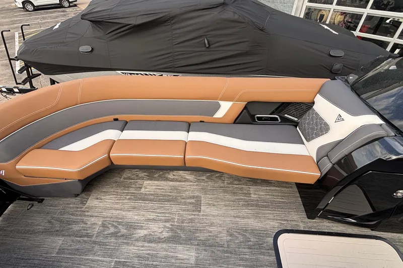 Slide: The Image of Luxurious seating on 2026 Viaggio Diamante U 26 boat, featuring tan and gray upholstery. - 16