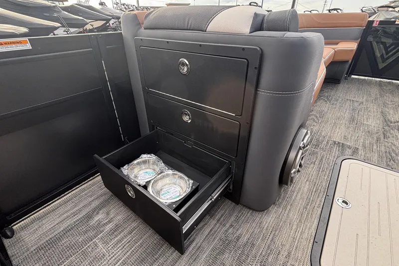 Slide: The Image of Viaggio Diamante U 26 boat interior with open storage drawer and pet bowls, 2026 model. - 33