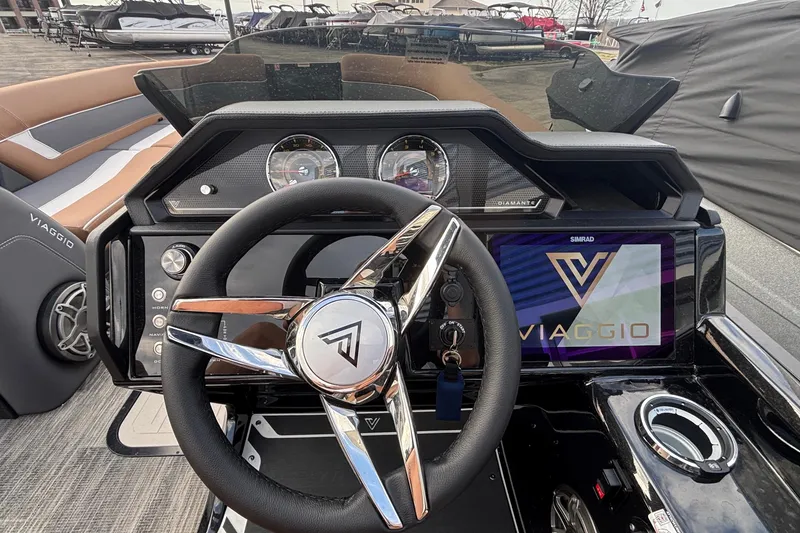 Slide: The Image of 2026 Viaggio Diamante U 26 boat dashboard with steering wheel and digital display. - 9