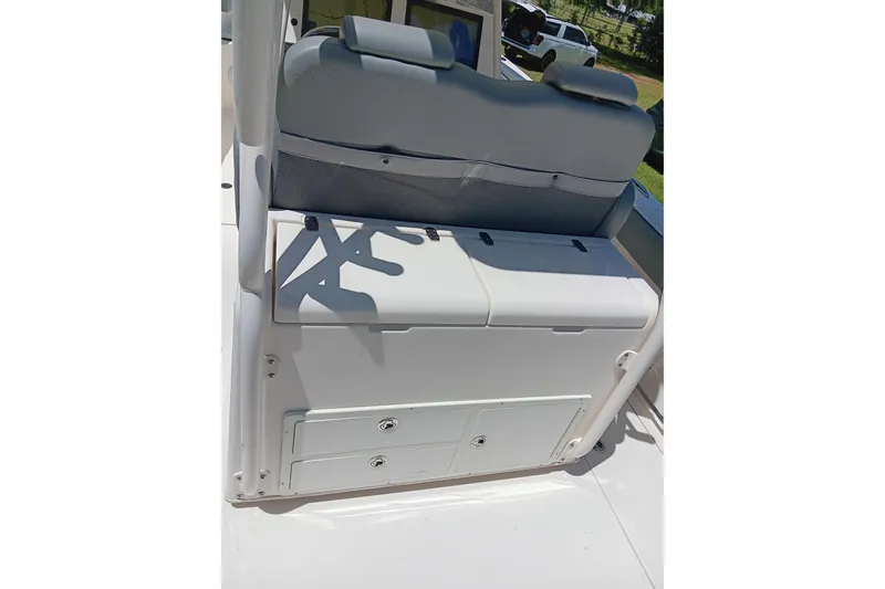 Slide: The Image of 2014 Cobia 296 Center Console boat seat and storage compartment. - 11