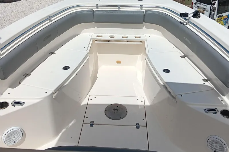 Slide: The Image of 2014 Cobia 296 Center Console boat interior with spacious seating and storage compartments. - 31