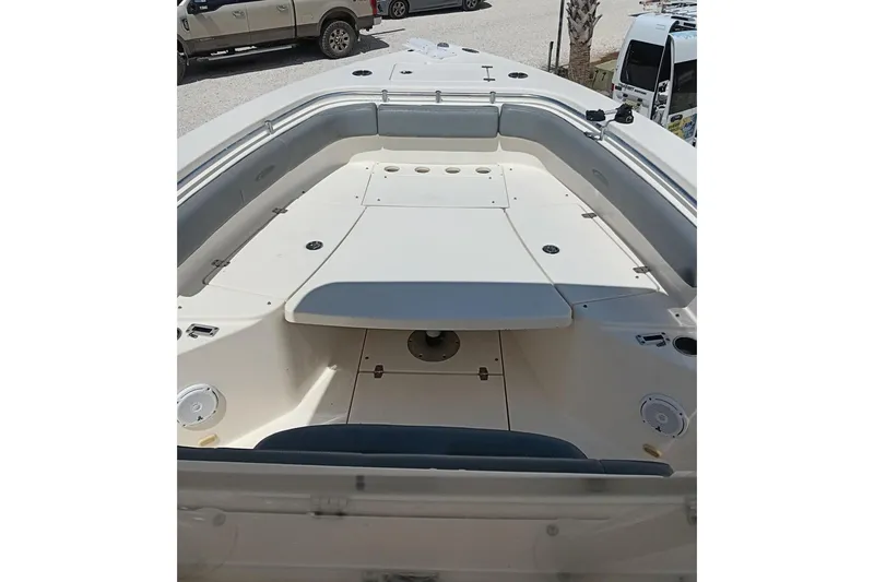 Slide: The Image of 2014 Cobia 296 Center Console boat interior with spacious seating and storage. - 44