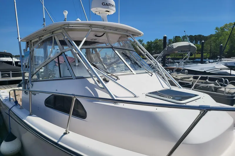 The Image of 2004 Grady-White Marlin 300 boat docked, featuring sleek design and sturdy construction. - 0