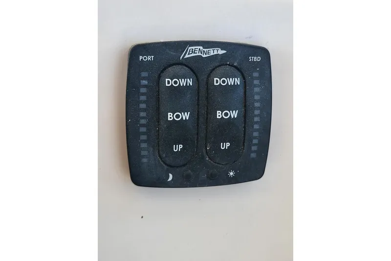 Slide: The Image of Bennett trim tab control panel on 2004 Grady-White Marlin 300 boat. - 11